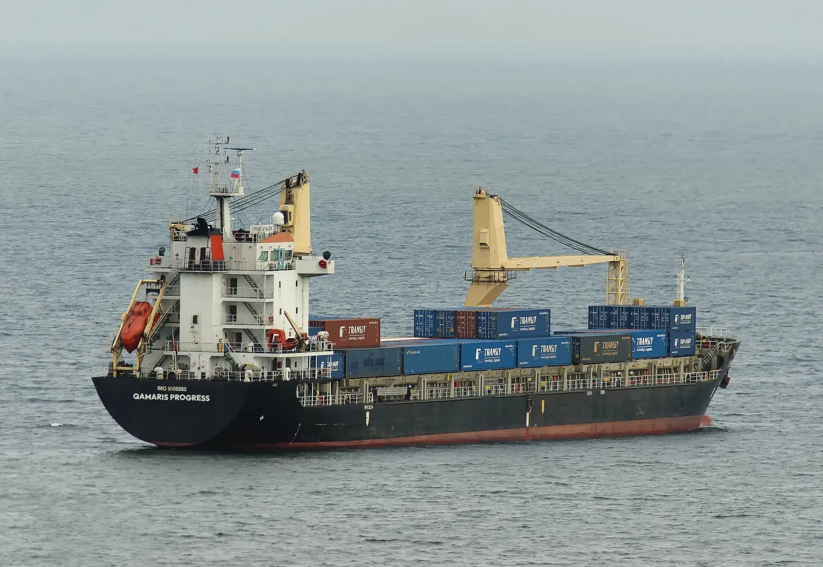 Container ship sailing on calm water